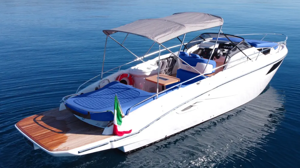 Porto Cervo rent a boat luxury yacht anchored in Costa Smeralda turquoise waters