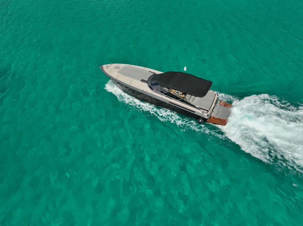 Baia 43 luxury yacht charter cruising in turquoise waters Sardinia aerial view