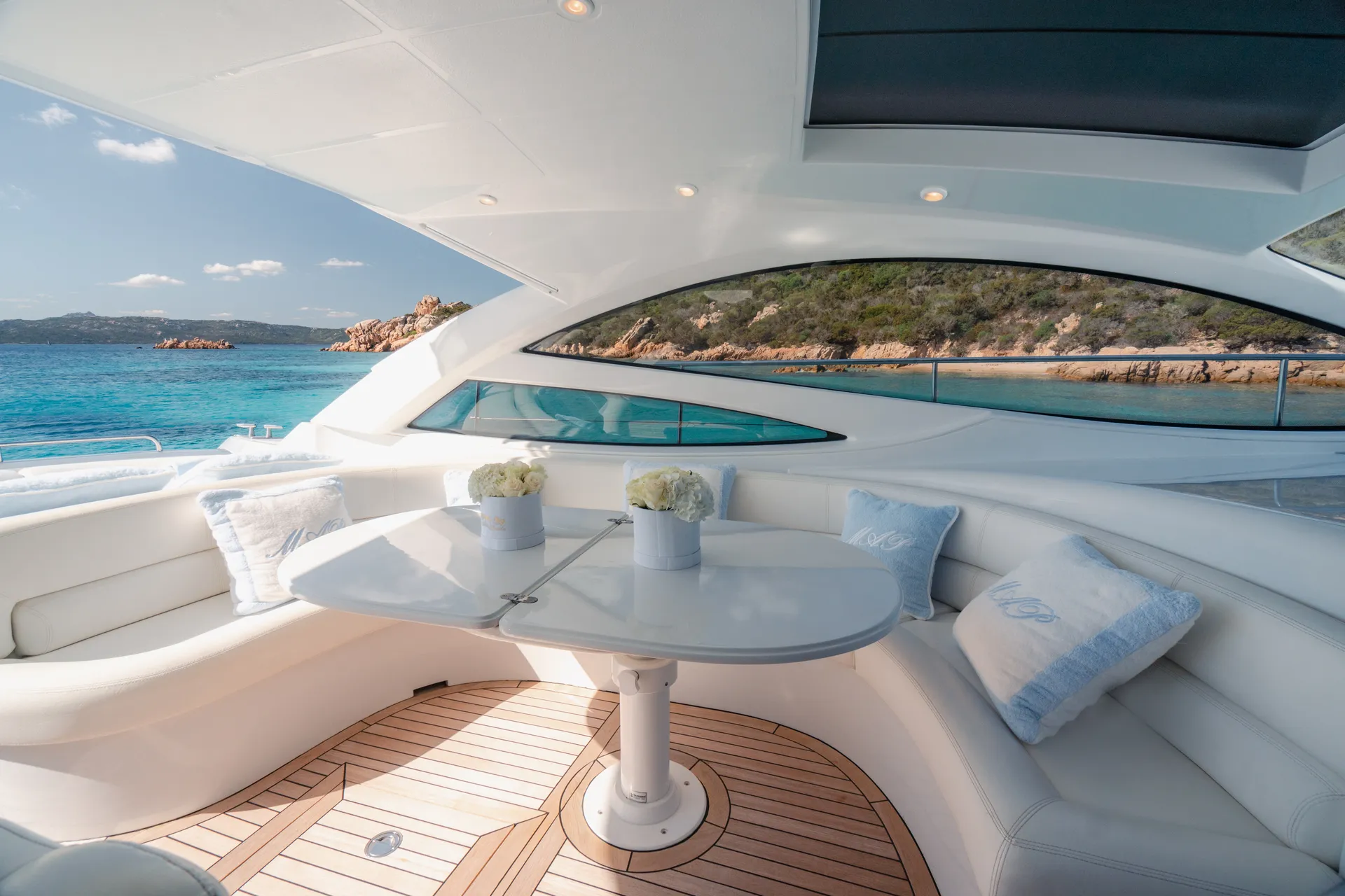 Elegant Pershing 46 yacht interior bedroom with sea view window Sardinia