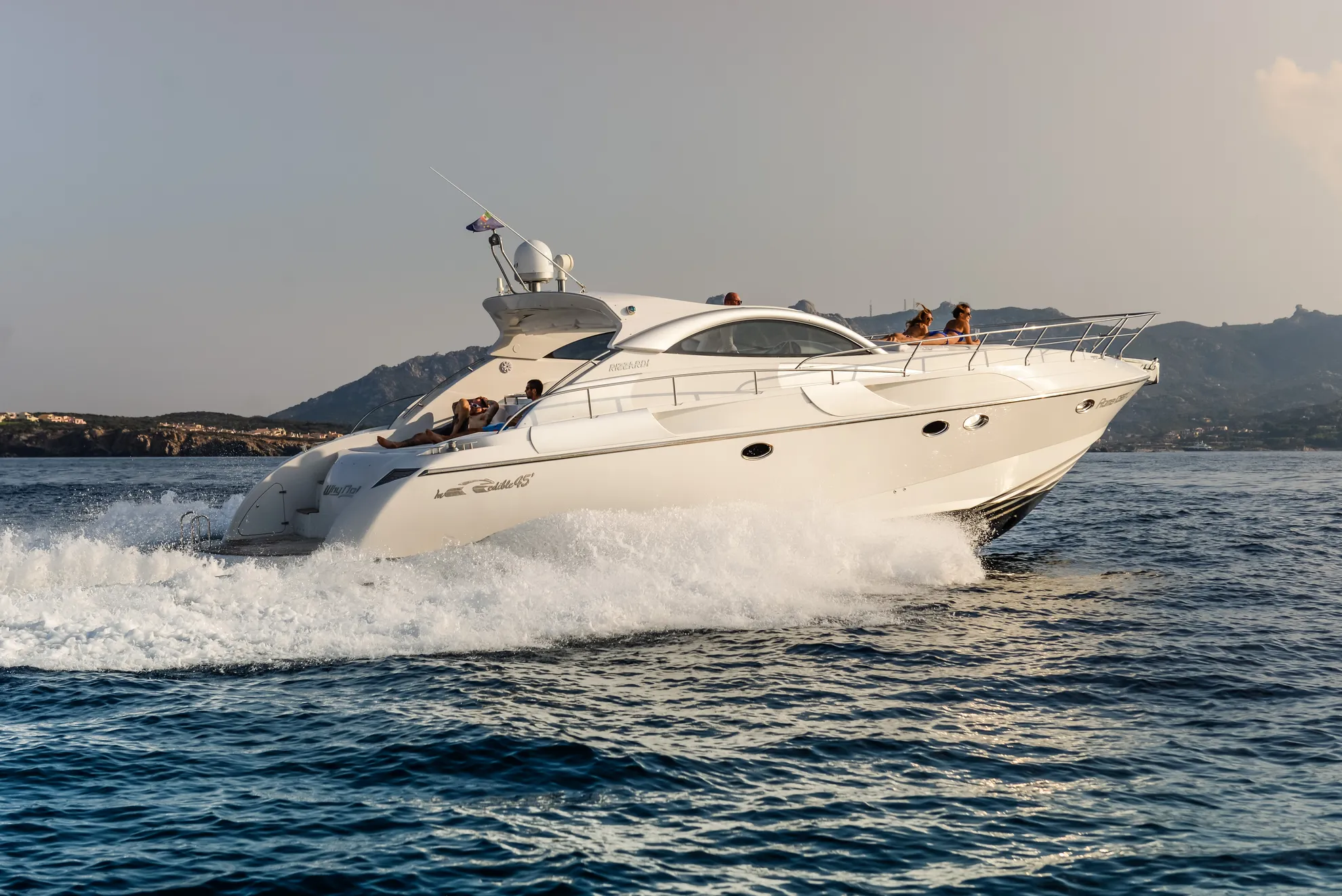 Rizzardi 45 luxury yacht charter cruising at sunset Porto Cervo Sardinia Italy